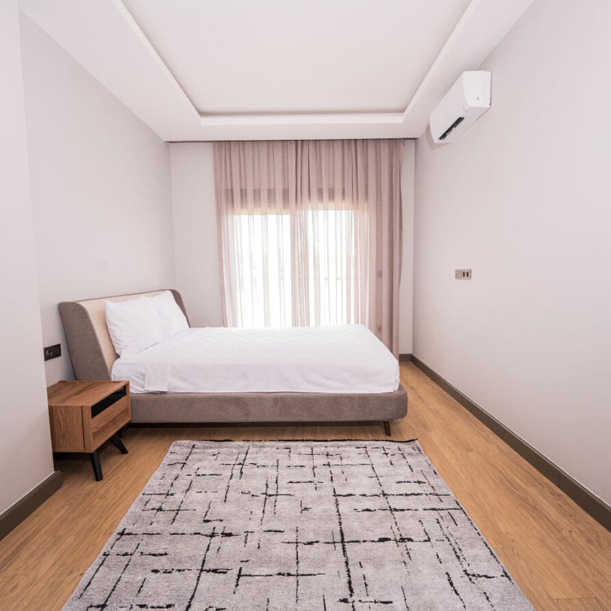 elegant bedroom in luxury garden view suite lara breeze